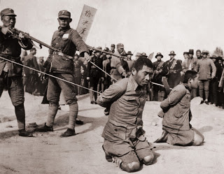 communism terrorism execution china korea Courtesy of Everett Historical Shutterstockcom_242821915